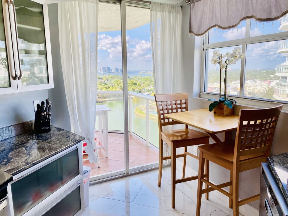 Kitchen table+ 2 stools with Ocean view from that window