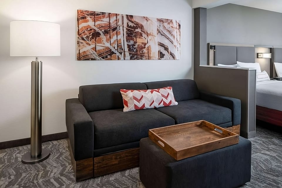 Kick back on the sofa with warm light and art.