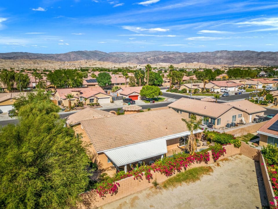 View of privacy fence and home