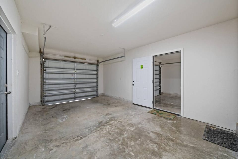 `Spacious Ground-Level Garage – Room for Beach Gear, Bikes, or One Vehicle`