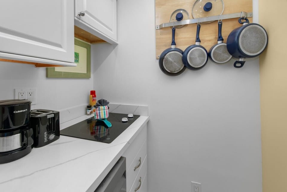 An electric 2 burner cook-top, all necessary cooking supplies included, coffee makerm, toaster and coffee/creamer/sugar supplied.