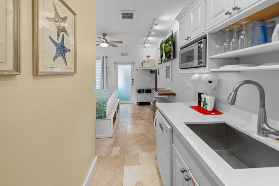 Breakfast bar with swivel stools.  Large smart TV with full line-up of Comcast channels.  Lamps with USB charging ports.