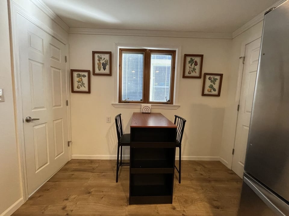 Kitchen
door to half bath on left
door to extra room and basement on right