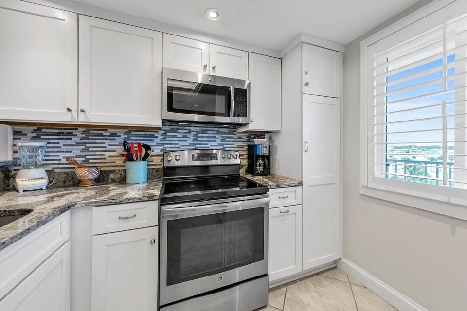 Your fully equipped kitchen awaits with granite counters, stainless appliances, and everything you need to create memorable meals during your stay.