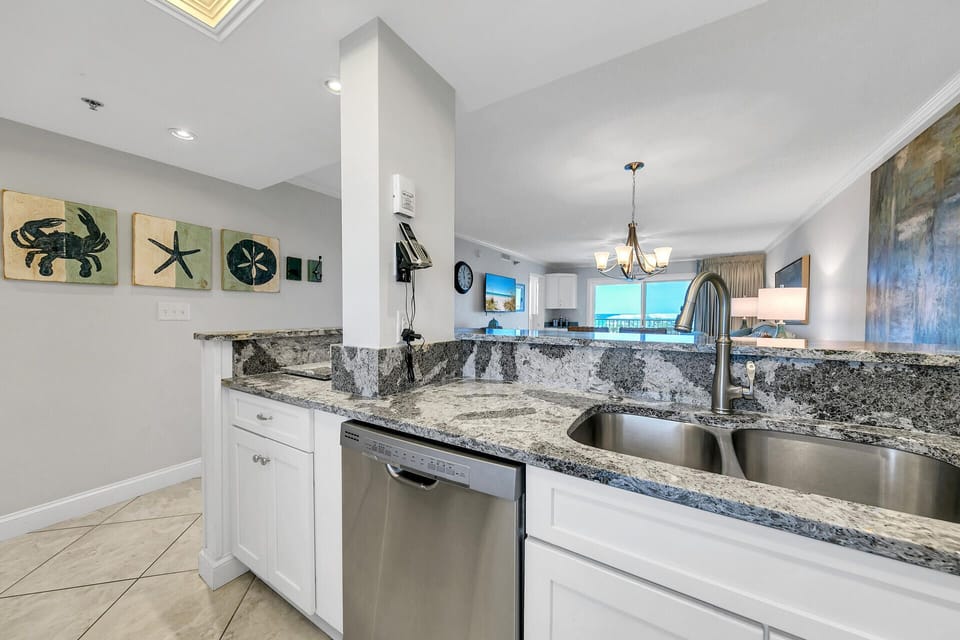 Your gourmet kitchen features elegant granite countertops, stainless steel appliances, and stunning ocean views perfect for preparing memorable meals.
