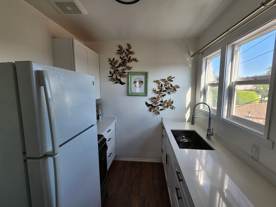 large kitchen with all utensils and cooking items