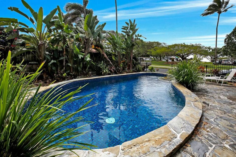 Poolside Paradise: Dive into relaxation in your private oasis surrounded by tropical greenery!