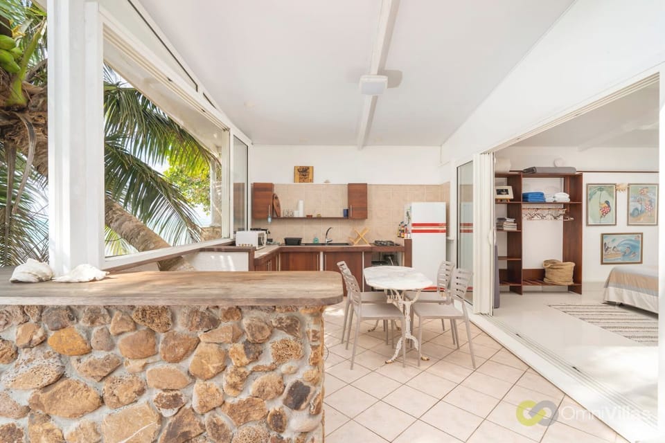 Indoor-outdoor dining area with tropical charm