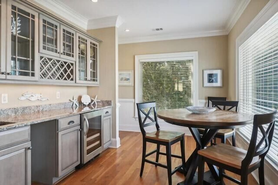 The wet bar & high-top table seat 4 for a board game or a great spot for remote workers!