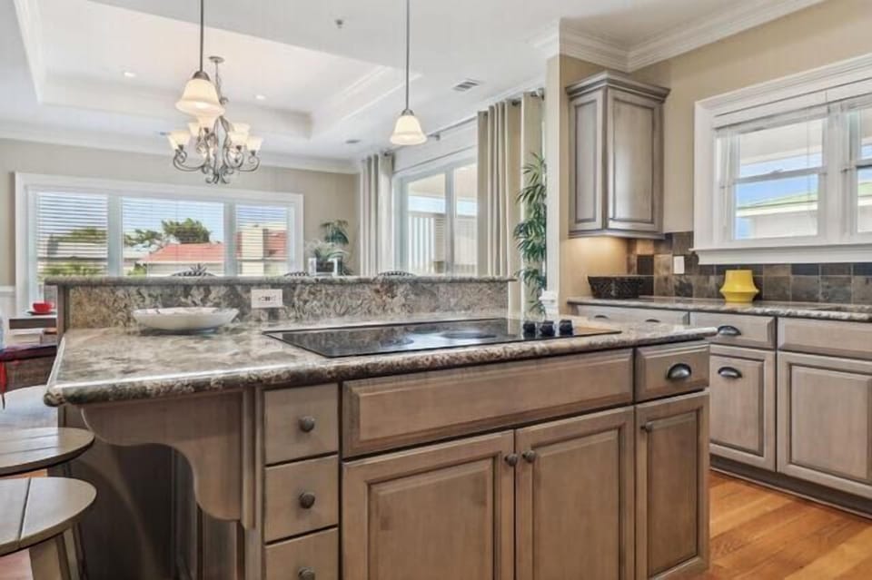 Stove top island with lots of storage & seating.