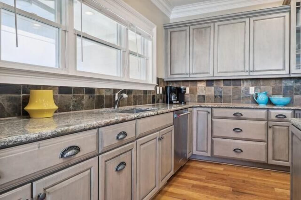 Our modern, newly renovated kitchen features granite counters, stainless steel appliances & plenty of utensils for all the entertaining you want!