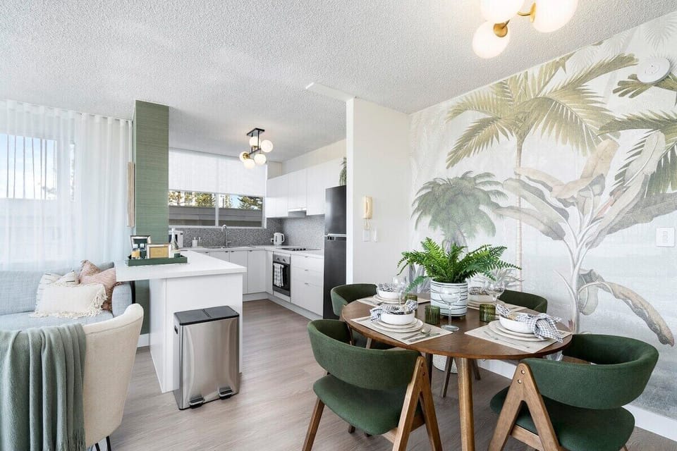 Open-plan kitchen and dining are with table for 4.