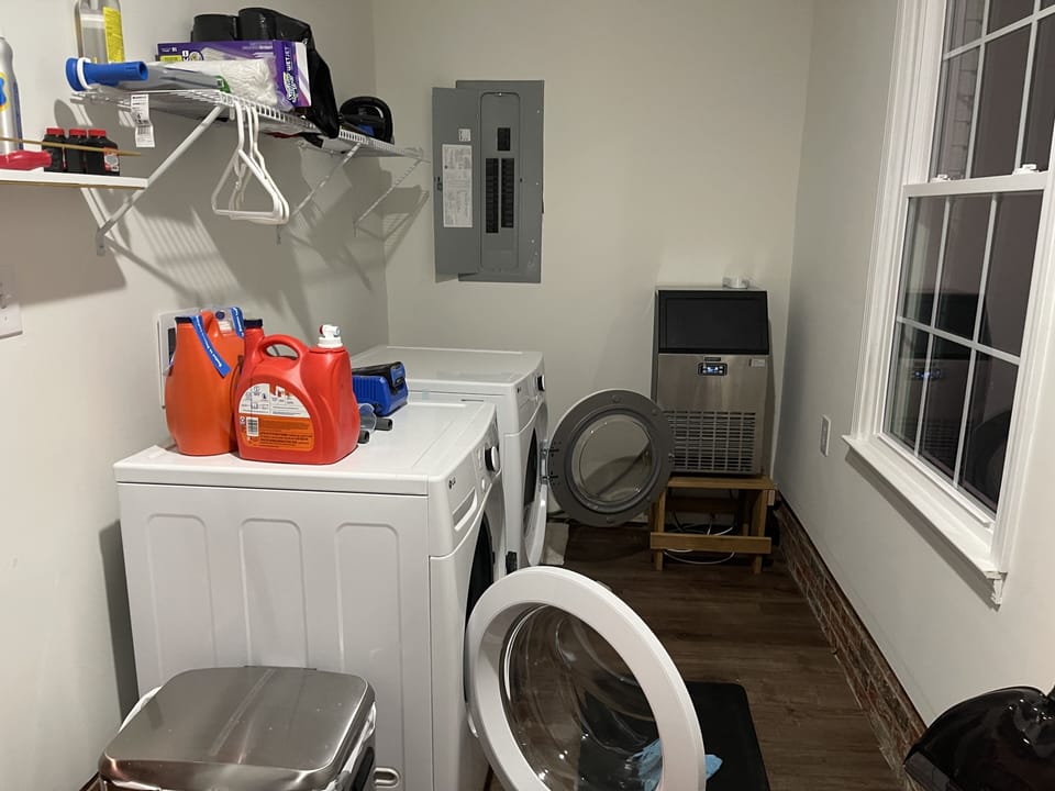 Stand alone ice maker in laundry area off the car port.