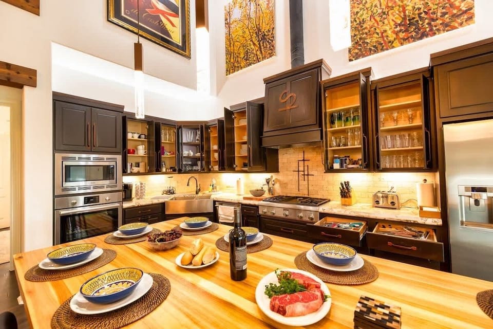 As you can see, the cabinets are filled with all you will need in this fully stocked kitchen. 
