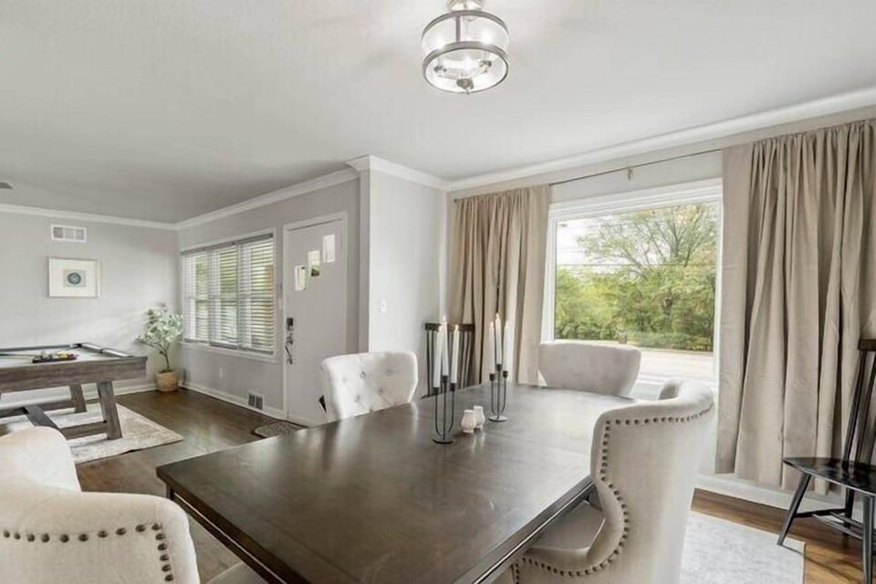 Floor to ceiling black out curtains are provided for privacy.
