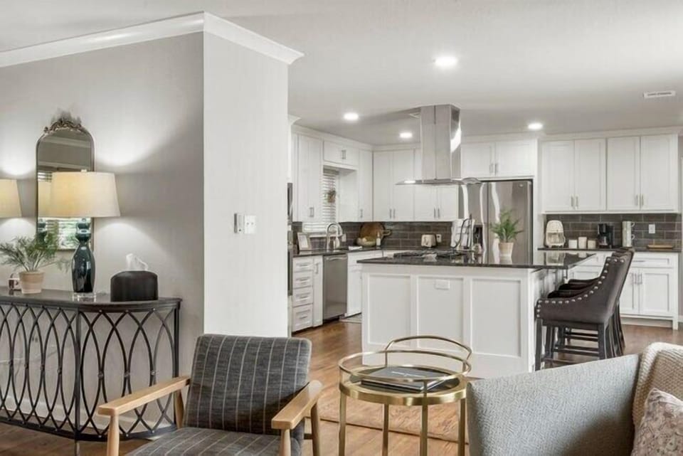Huge island in the kitchen provides storage on both sides and extra seating.