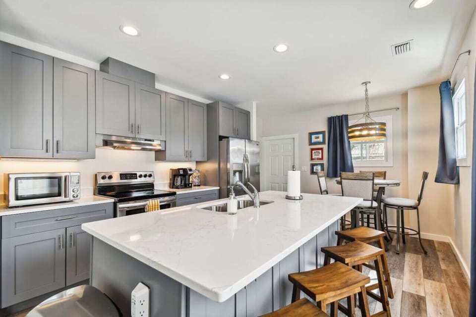 Fully equipped kitchen with modern appliances and ample space for preparing meals during your stay.