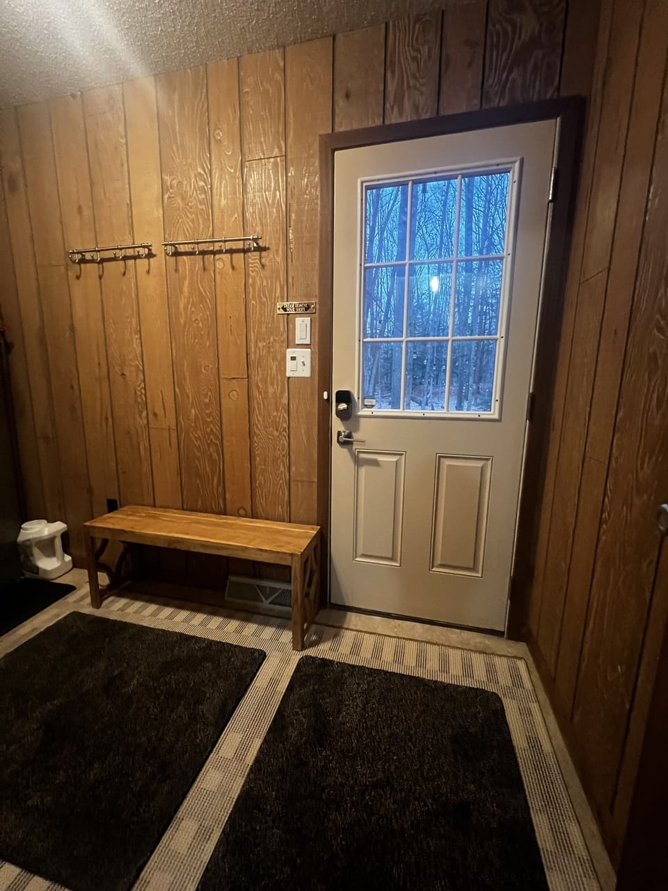 Main floor laundry / mud room with plenty of space and hooks for all your goods