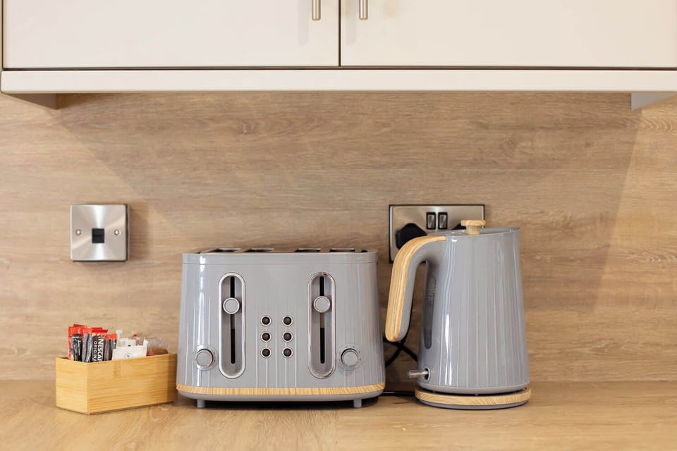 Matching grey kettle and toaster set make morning brews and breakfast a breeze.

