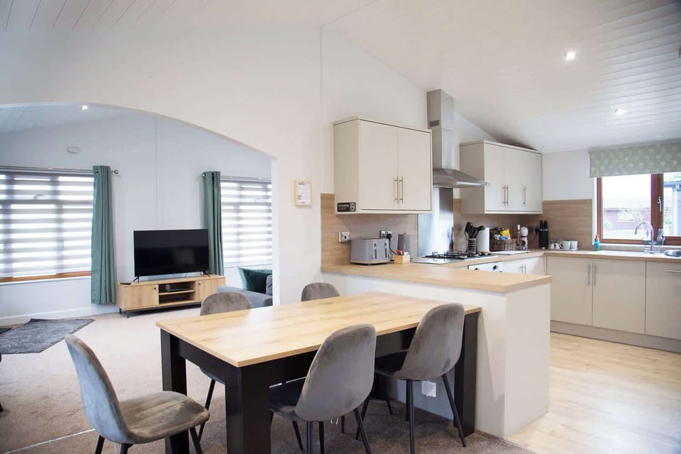 Open-plan kitchen and dining for easy family living with space to relax, cook, and connect.