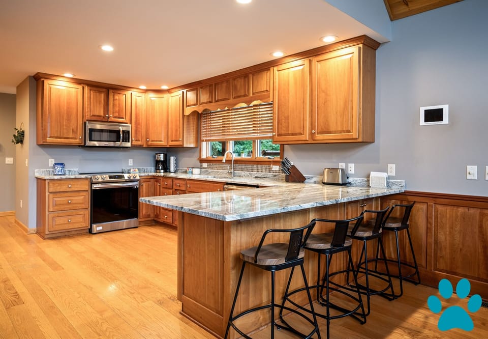Large custom kitchen has all the amenities you need to make some amazing home cooked meals.. Additional seating at the breakfast bar.