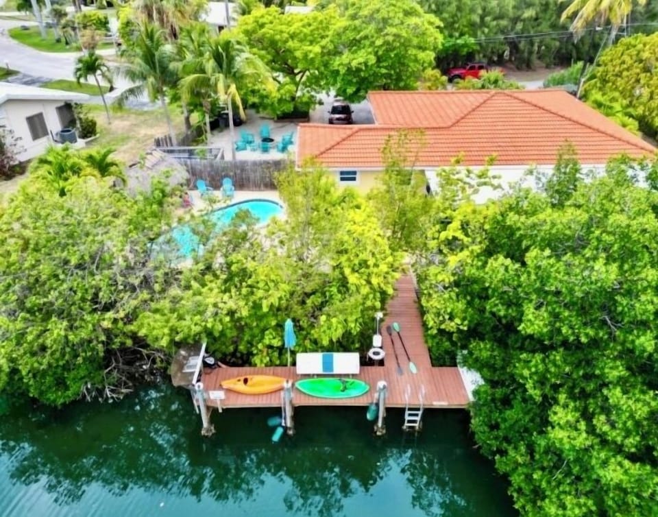 Aerial view of Casa Negroni. Dock features mangrove, button wood & sea grape