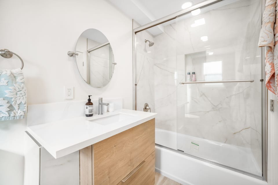 This bathroom is located in the guest bedroom. Large bathroom with tub.