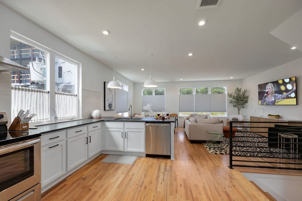 2nd Floor: Fully equipped kitchen boasting stainless steel appliances and stocked with all culinary essentials.