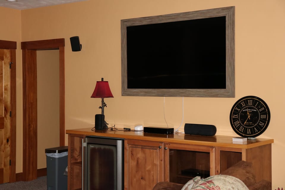 lower level, large TV with cable box, stereo