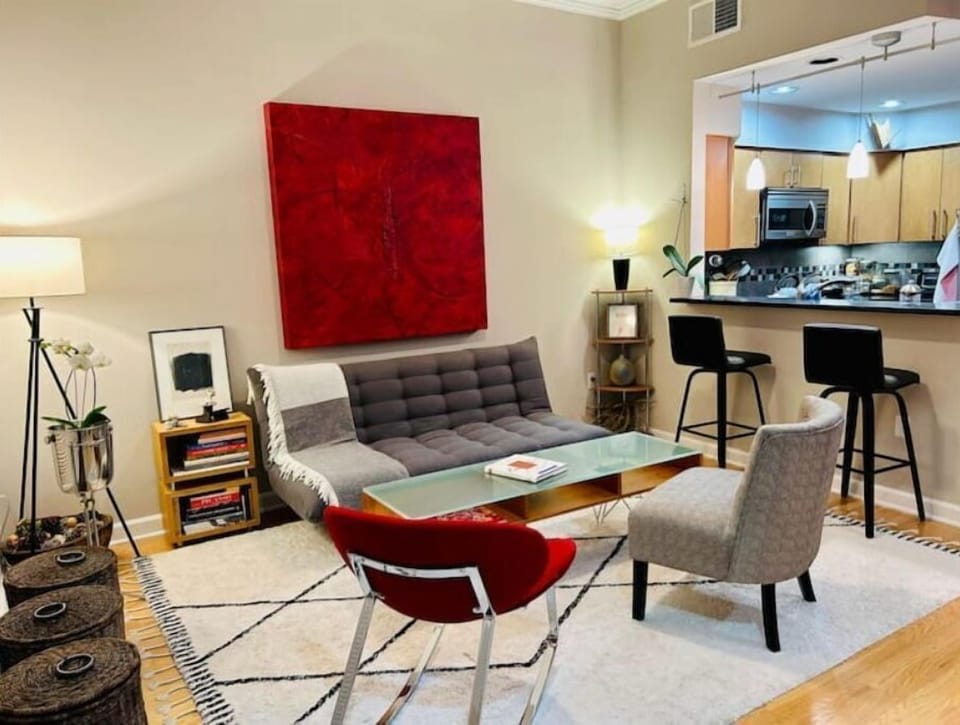 The living/dining area. The original art throughout my condo changes regularly. 