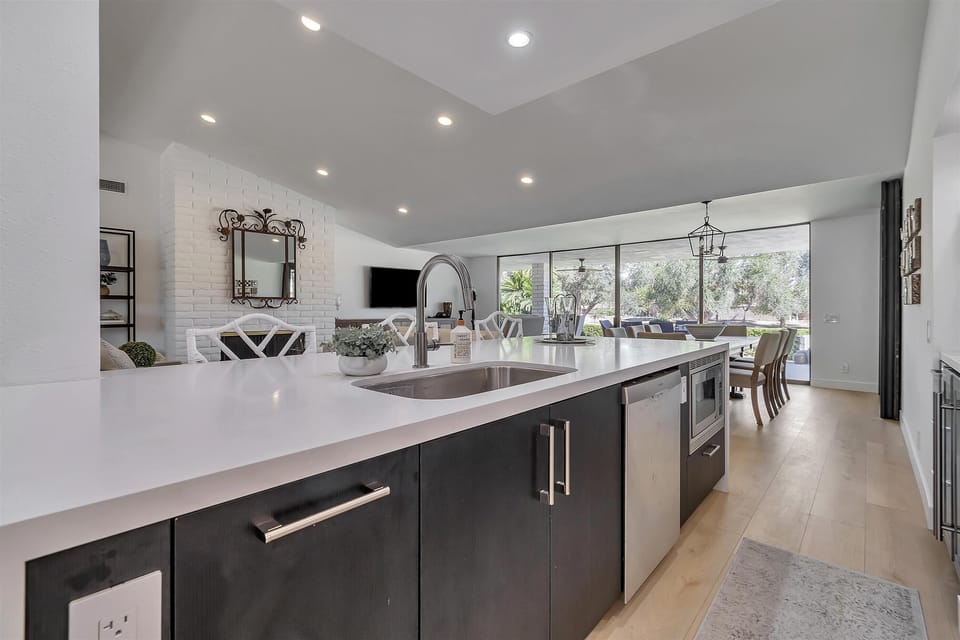Kitchen Island: built in sink, dishwasher and microwave. Bar seating for three.