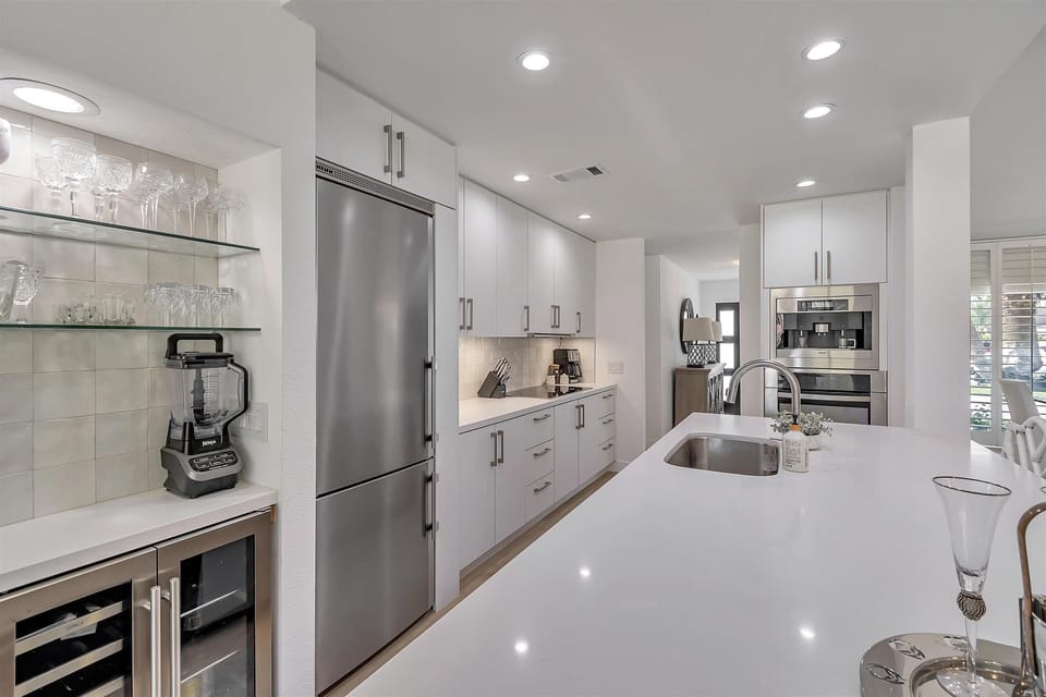 Top of the line appliances: built in coffee maker and oven. 