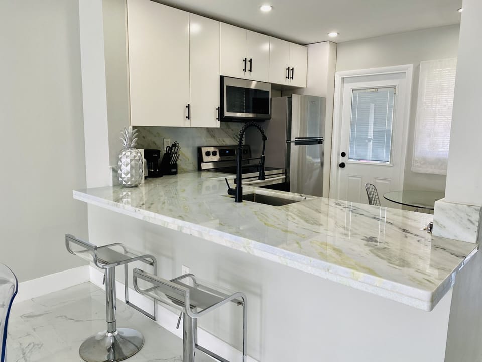 Kitchen sitting area with bar stools
