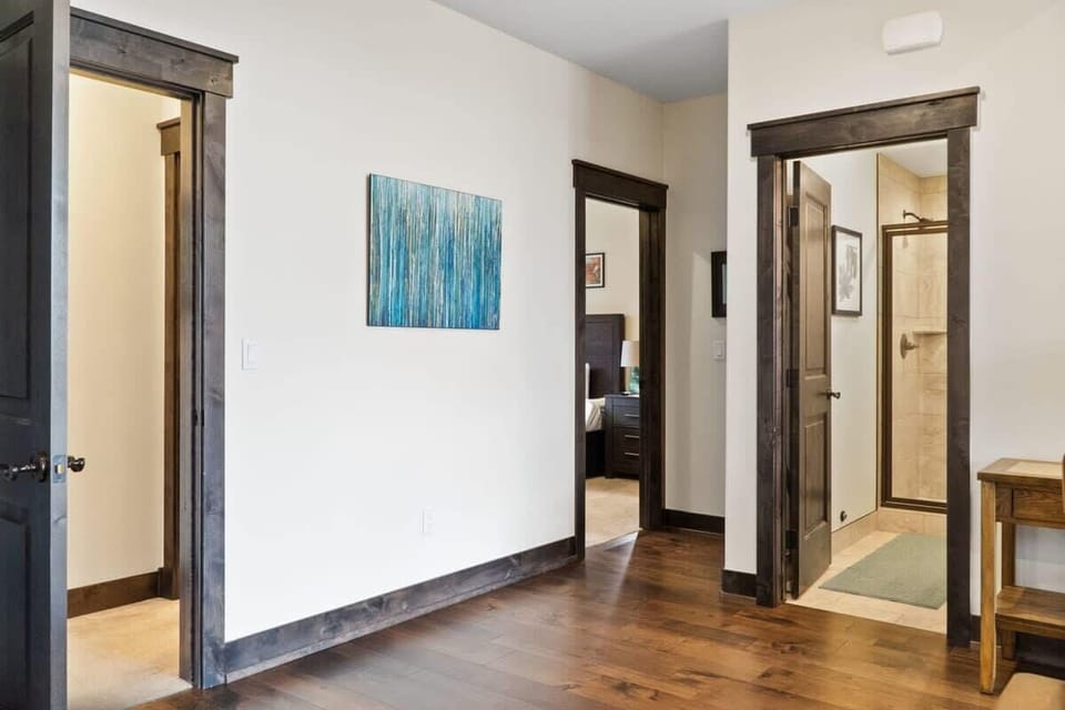 The view of the hallway off the kitchen where you will find two bedrooms and a full bathroom.