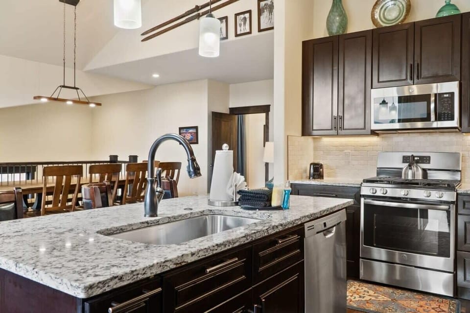 The open layout of the shared living space means you won’t have to miss a thing while preparing meals or doing dishes.