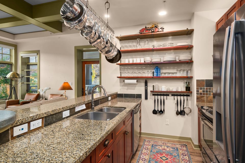 The large windows look out at the surrounding mountains and create a bright and inviting feeling while preparing meals in the kitchen.
