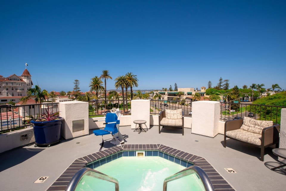 Soak under blue skies with panoramic coastal rooftop views.