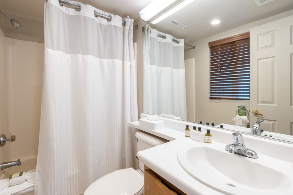 Refresh easily with bright vanity space and shower-tub combo.