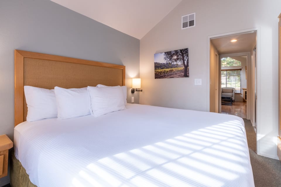 Settle in with a spacious bedroom layout and calm tones.
