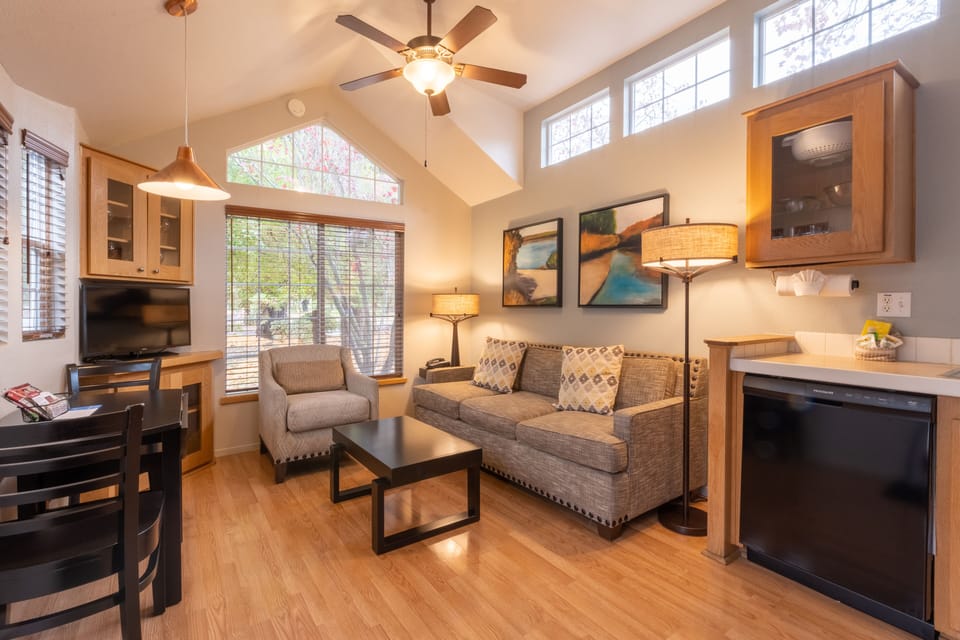 Unwind in the airy lounge with sofa, TV, and sunshine.