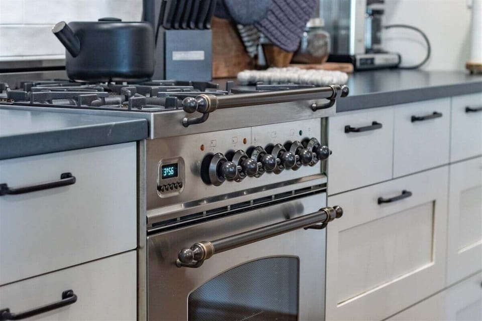 Antique details perfectly complement the contemporary cooking amenities.