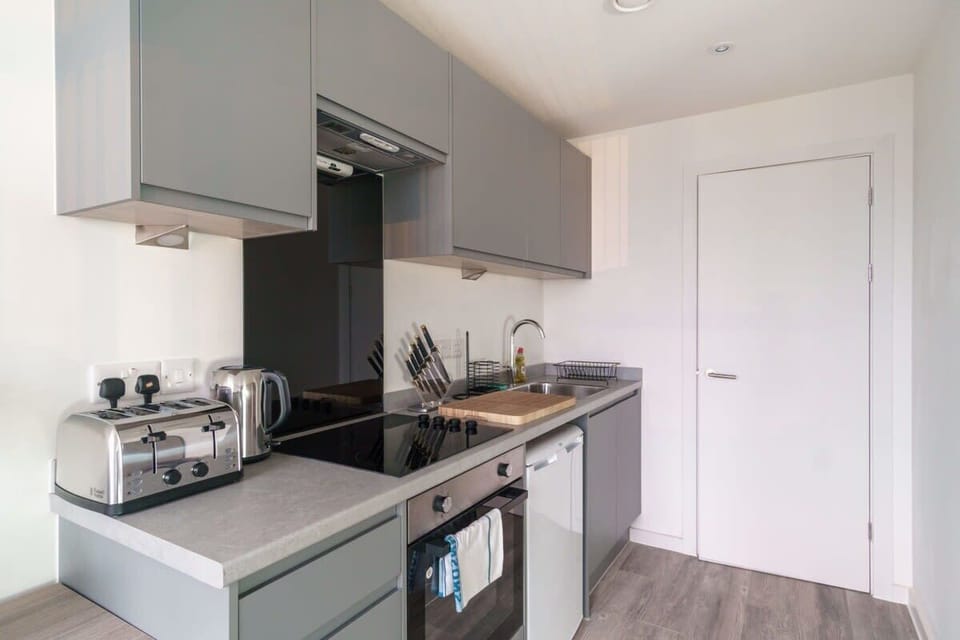 Chef-ready kitchen featuring integrated appliances, a full stovetop, and a high-performance oven—perfect for preparing your favorite meals at home.