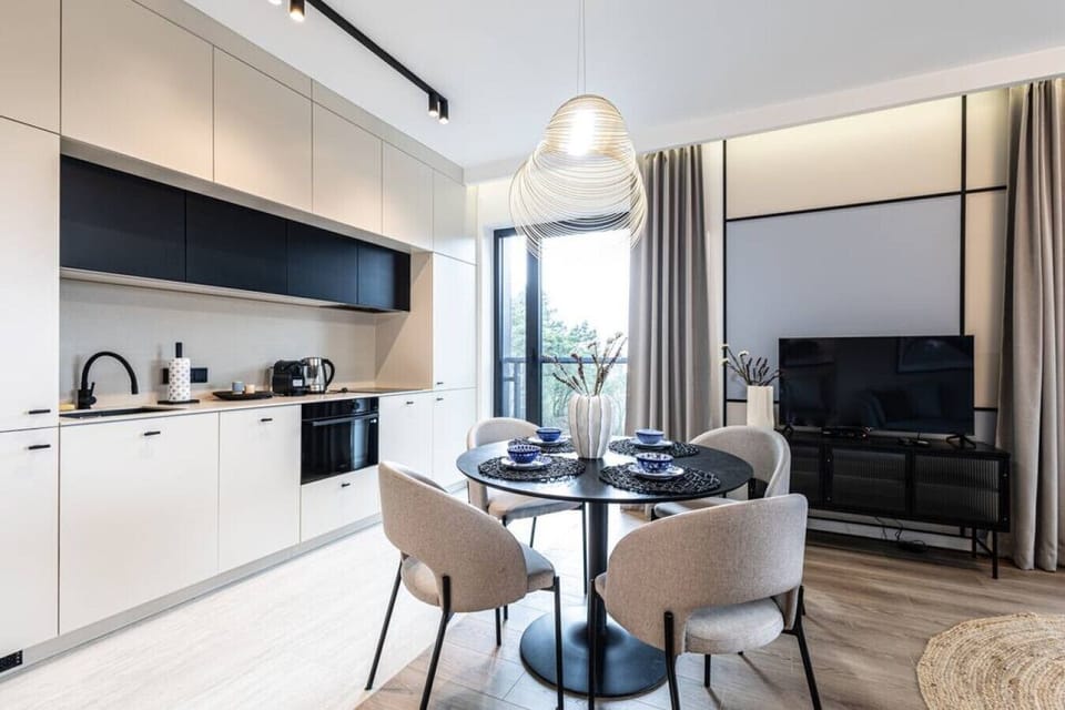 atmospheric and family dining table behind which you can see the kitchenette