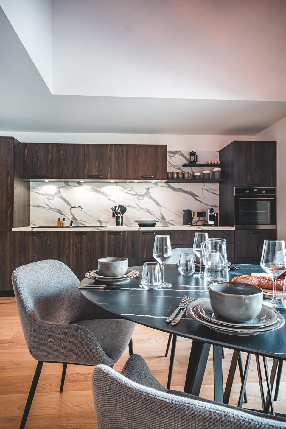 Dining table and modern fitted kitchen