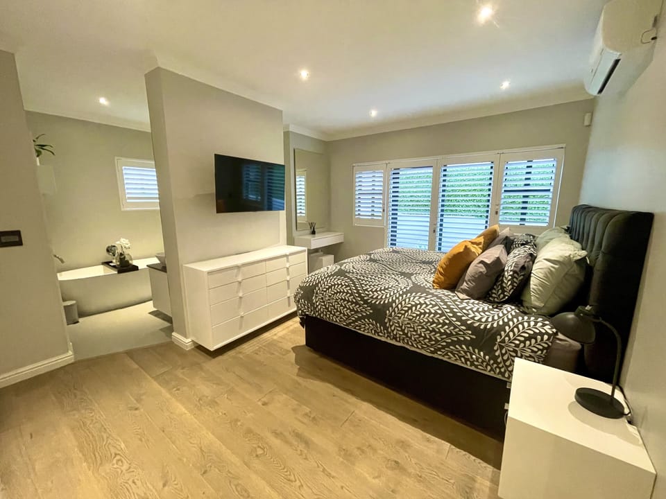 Main bedroom (XL King bed), en-suite bathroom and private toilet - downstairs