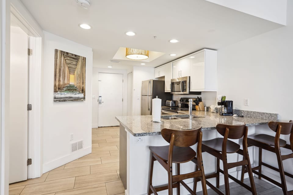 Fully Equipped Kitchen with Extra Seating at the Bar