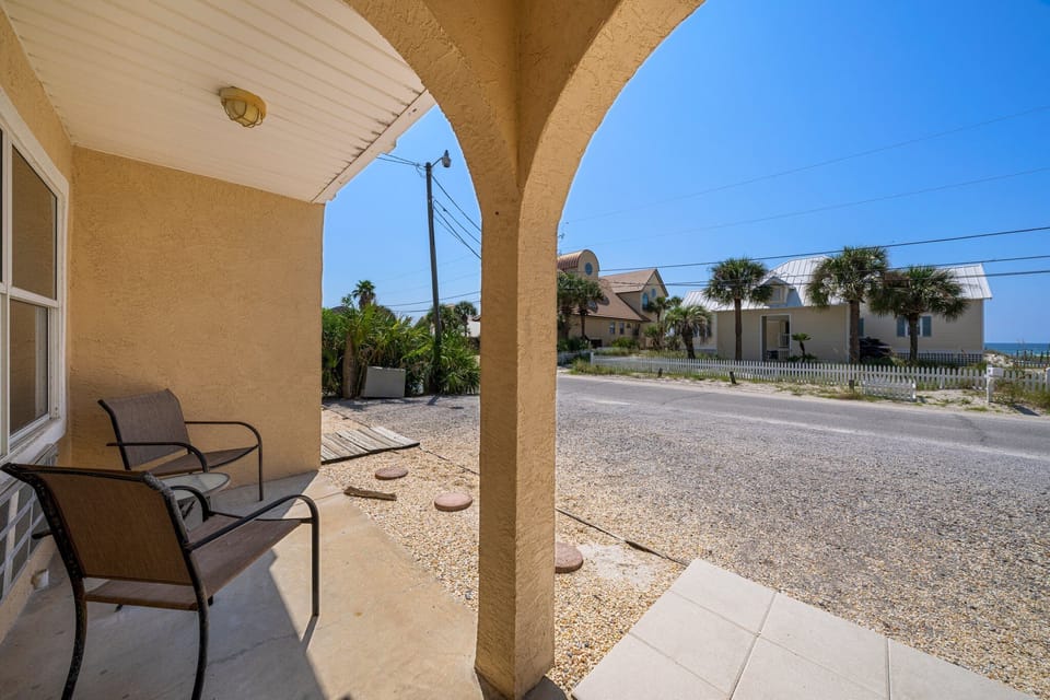 Sun-soaked walkway leading straight to the sand — beach days start right outside your door.