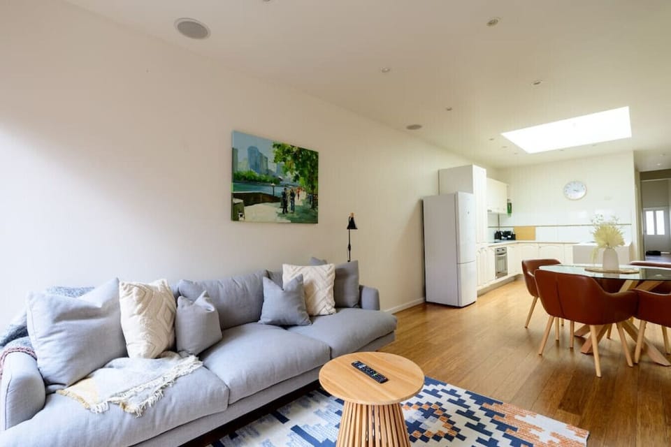 Cozy open-plan living room, kitchen and dining area.