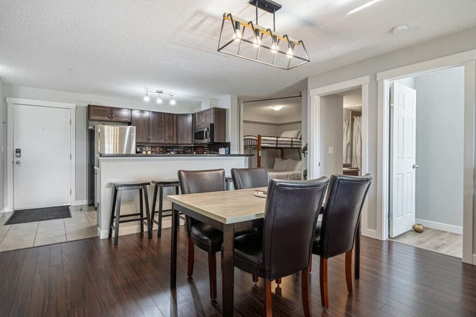 Dining area with seating for 4 at the table, and 4 at the island.