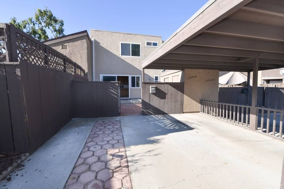 Patio entrance and 2 dedicated parking spaces.
